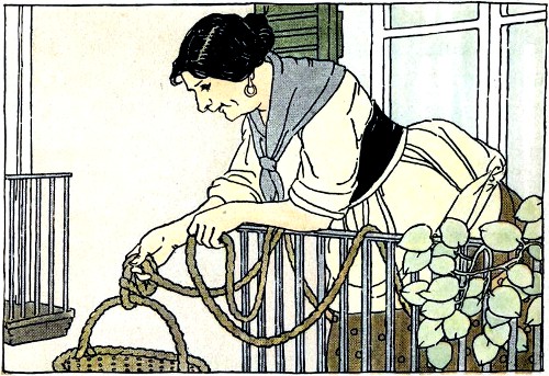 woman pulling up basket over balcony railing